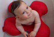baby in red Papillon bath seat